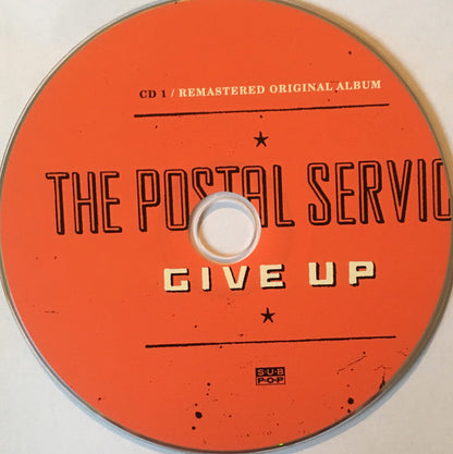 The Postal Service : Give Up (CD, Album, RE, RM + CD, Comp + Dlx, Del)